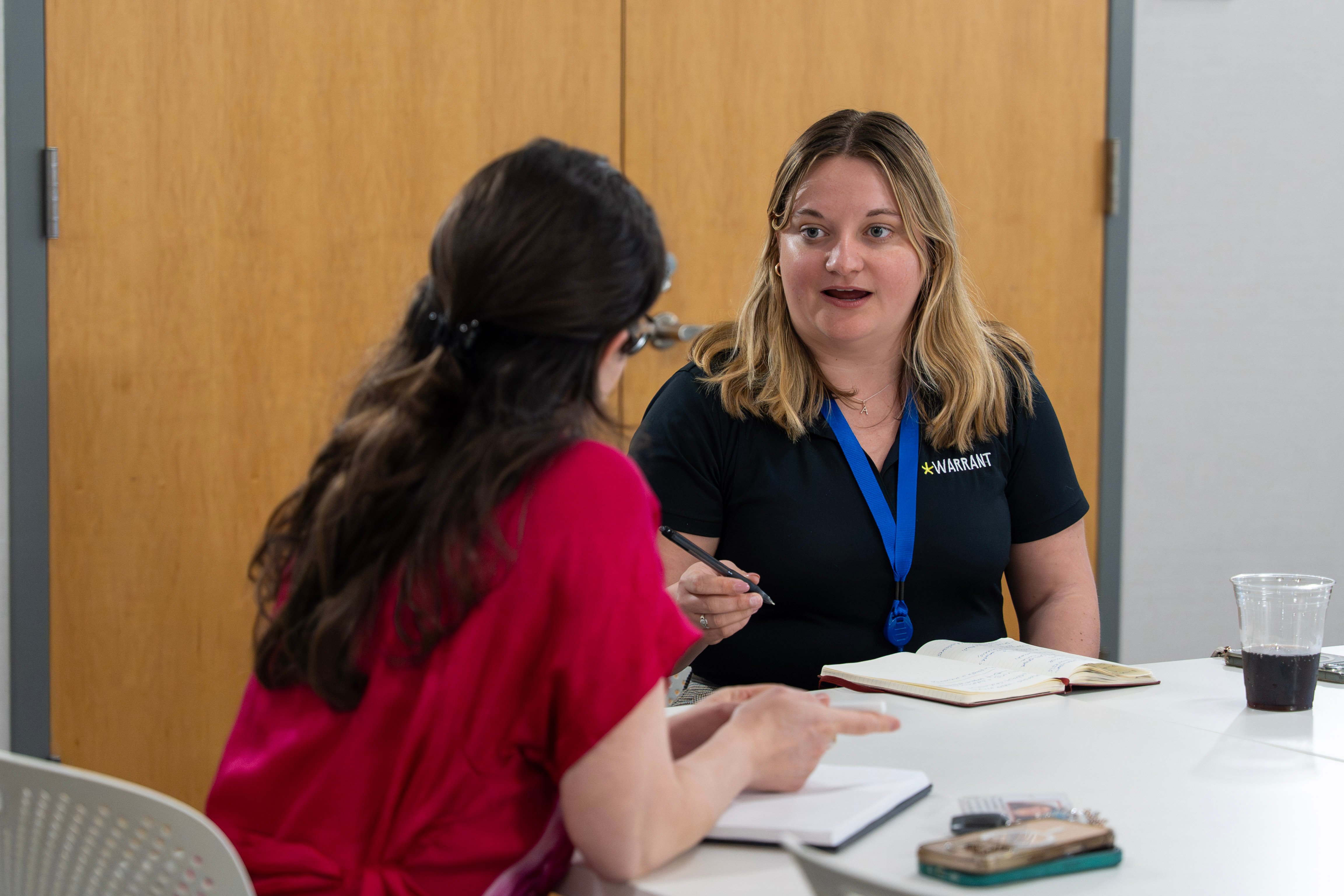 A Curql Accelerate fintech founder chatting with a credit union executive during a working session